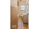 Bathroom with a vanity, toilet, and tiled shower-tub combination at 3829 N Temple Ave, Indianapolis, IN 46205