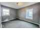 This cozy bedroom features neutral walls and a large window for ample natural light at 3829 N Temple Ave, Indianapolis, IN 46205