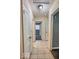Hallway with tiled floors, white doors, and good access to other rooms at 3829 N Temple Ave, Indianapolis, IN 46205