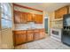 Functional kitchen with wood cabinets, a double sink, and essential appliances at 3829 N Temple Ave, Indianapolis, IN 46205