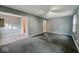 Bright living room with neutral paint, carpet flooring, and natural light at 3829 N Temple Ave, Indianapolis, IN 46205