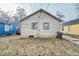 View of rear of home showing the siding, windows and access to backyard at 3829 N Temple Ave, Indianapolis, IN 46205