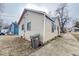 View of rear of home showing the siding, windows and access to backyard at 3829 N Temple Ave, Indianapolis, IN 46205