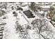 Aerial view of community tennis court and playground covered in snow at 3986 Braddock Rd, Indianapolis, IN 46268