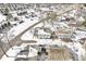 Birds eye view of neighborhood showcasing townhouses and winter snow covered streets at 3986 Braddock Rd, Indianapolis, IN 46268
