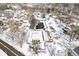 Overhead shot of a snowy neighborhood featuring community pool and tennis court at 3986 Braddock Rd, Indianapolis, IN 46268