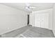 Spacious bedroom with a ceiling fan and a closet featuring double doors for ample storage at 3986 Braddock Rd, Indianapolis, IN 46268
