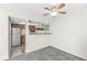 Kitchen featuring stainless steel appliances, dark cabinetry, laminate countertops and wood-look flooring at 3986 Braddock Rd, Indianapolis, IN 46268