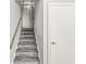 Carpeted stairs leading to the upper level, complemented by neutral wall paint at 3986 Braddock Rd, Indianapolis, IN 46268