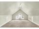 Spacious attic space featuring carpeting, updated paint, and natural light at 4029 Broadway St, Indianapolis, IN 46205