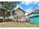 Spacious backyard featuring a two-story home with a white door, perfect for outdoor gatherings at 4029 Broadway St, Indianapolis, IN 46205
