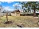 Large backyard featuring a shed with red roof, offering plenty of space for outdoor activities and relaxation at 4029 Broadway St, Indianapolis, IN 46205