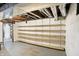 Unfinished basement featuring open shelving, and exposed ductwork and beams at 4029 Broadway St, Indianapolis, IN 46205