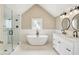 Modern bathroom featuring a glass-enclosed shower, freestanding tub, dual sink vanity, and sleek fixtures at 4029 Broadway St, Indianapolis, IN 46205
