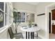 Sunlit breakfast nook with window views and a marble-topped table and seating at 4029 Broadway St, Indianapolis, IN 46205