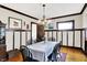 Traditional dining room with dark trim, hardwood floors, and a striped tablecloth at 4029 Broadway St, Indianapolis, IN 46205