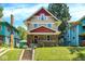Charming two-story home with red and tan siding, brick-lined porch, and inviting curb appeal at 4029 Broadway St, Indianapolis, IN 46205