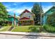 Beautiful craftsman home, featuring a well-maintained lawn and colorful neighboring houses at 4029 Broadway St, Indianapolis, IN 46205