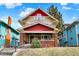 Charming two-story home with red accents and a welcoming front porch and an unkempt lawn at 4029 Broadway St, Indianapolis, IN 46205