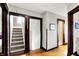 Hallway with wood floors and staircase at 4029 Broadway St, Indianapolis, IN 46205
