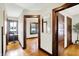 Hallway featuring hardwood floors and a view of the front door at 4029 Broadway St, Indianapolis, IN 46205