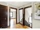 Hallway with hardwood floors and staircase at 4029 Broadway St, Indianapolis, IN 46205