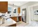 Modern kitchen featuring stainless steel appliances, bright countertops, and a view to the backyard at 4029 Broadway St, Indianapolis, IN 46205