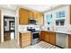 Charming kitchen with stainless steel appliances, bright white countertops, and ample cabinet space at 4029 Broadway St, Indianapolis, IN 46205
