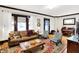 Bright and airy living room featuring hardwood floors, stylish furniture, and large windows at 4029 Broadway St, Indianapolis, IN 46205