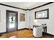 Sunny home office includes hardwood floors, natural light, and classic charm at 4029 Broadway St, Indianapolis, IN 46205