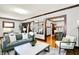 Comfortable living room showcasing hardwood floors, fireplace, and an open layout perfect for entertaining at 4029 Broadway St, Indianapolis, IN 46205
