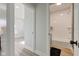 This bathroom includes a white tiled shower, a toilet, and a vanity at 4804 Brouse Ave, Indianapolis, IN 46205