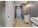 Bathroom with wooden floors, custom vanities, closet and natural light at 4804 Brouse Ave, Indianapolis, IN 46205