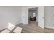 Bedroom leads into living room with wooden floors and natural light at 4804 Brouse Ave, Indianapolis, IN 46205