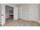 Bedroom with wooden floors features an open door to the next bedroom at 4804 Brouse Ave, Indianapolis, IN 46205