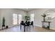 Bright dining area features a modern table setting and access to the outdoor deck through glass doors at 4804 Brouse Ave, Indianapolis, IN 46205