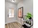 Bright entryway features a modern shelf with plants and a front door with glass panels for natural light at 4804 Brouse Ave, Indianapolis, IN 46205