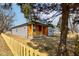 View of charming home with siding and a cute front porch protected by a picket fence and mature landscaping at 4804 Brouse Ave, Indianapolis, IN 46205