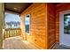 View of the front porch with attractive wood cladding and white trim details, leading to the home's entrance at 4804 Brouse Ave, Indianapolis, IN 46205