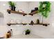 The kitchen features floating wood shelves, white subway tile, and granite countertops at 4804 Brouse Ave, Indianapolis, IN 46205