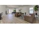 Spacious living room with wood-look floors, modern furniture, and lots of natural light from multiple windows at 4804 Brouse Ave, Indianapolis, IN 46205