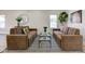 Cozy living room featuring modern sofas, glass tables, and a stylish rug, perfect for relaxation and entertainment at 4804 Brouse Ave, Indianapolis, IN 46205
