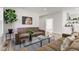 Bright, open-concept living room with modern furnishings and views into the kitchen, perfect for entertaining at 4804 Brouse Ave, Indianapolis, IN 46205