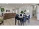 A view of the open-concept living area and dining space flowing seamlessly into the modern kitchen at 4804 Brouse Ave, Indianapolis, IN 46205