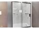 Modern shower with clear glass doors and marble tile at 4804 Brouse Ave, Indianapolis, IN 46205