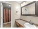 Bathroom with a granite vanity, large mirror, decorative lighting, and a shower with curtain at 4947 Cherryhill Ct, Indianapolis, IN 46254