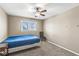Bedroom featuring neutral walls, carpet flooring, window, and a ceiling fan with light fixture at 4947 Cherryhill Ct, Indianapolis, IN 46254
