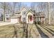 Charming two-story home featuring a red front door and brick and siding exterior at 4947 Cherryhill Ct, Indianapolis, IN 46254