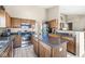 Traditional kitchen featuring wooden cabinets, a stainless steel oven, and a central island at 4947 Cherryhill Ct, Indianapolis, IN 46254
