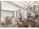 Inviting living room featuring comfortable seating, a staircase, and abundant natural light at 4947 Cherryhill Ct, Indianapolis, IN 46254